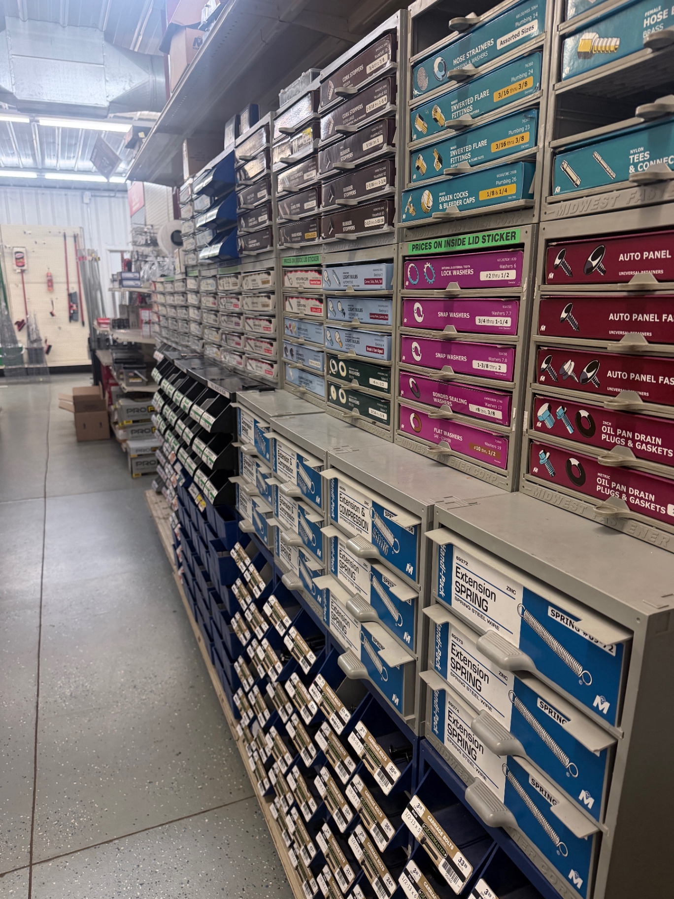 Rows of specialty fasteners, washers, springs and small hardware drawers